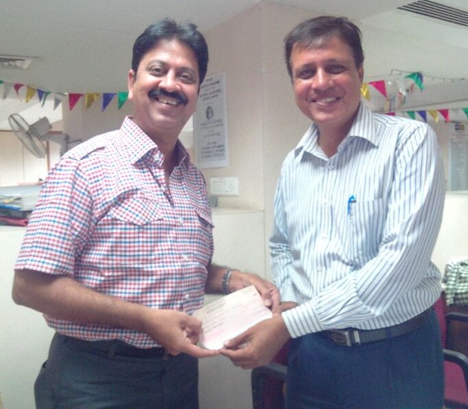 Handing over 1 Crore premium cheque to Shri Bipin Raje, SBA