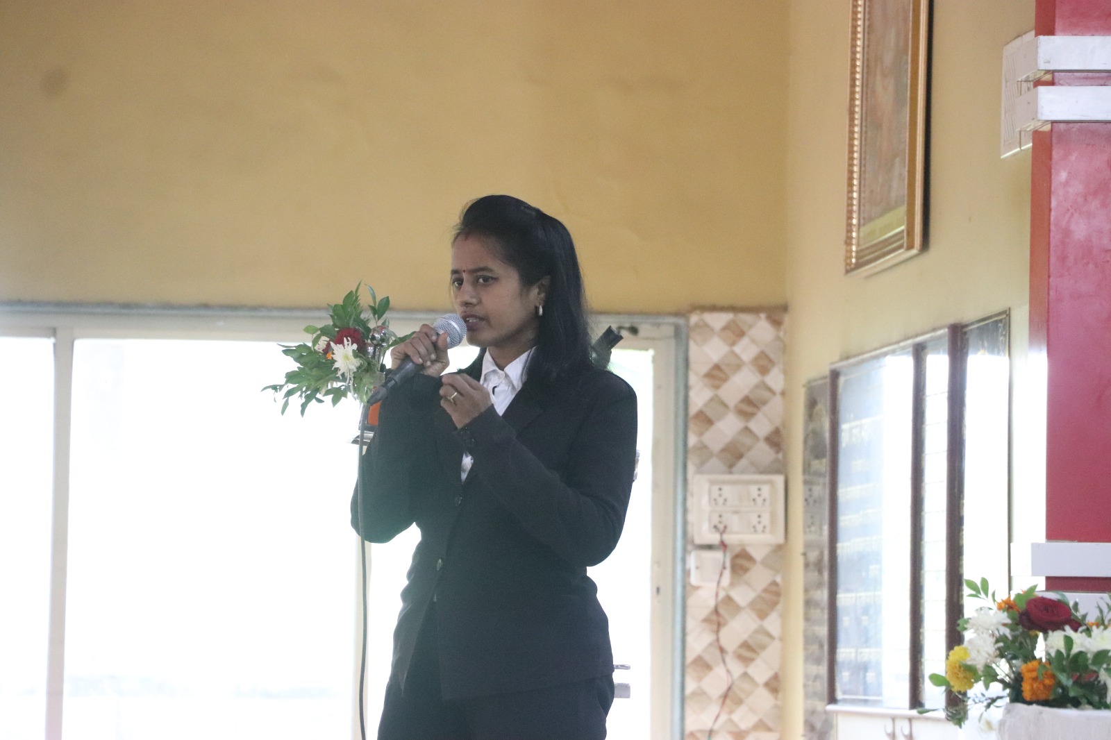 Addressing to audience importance of child education and planning