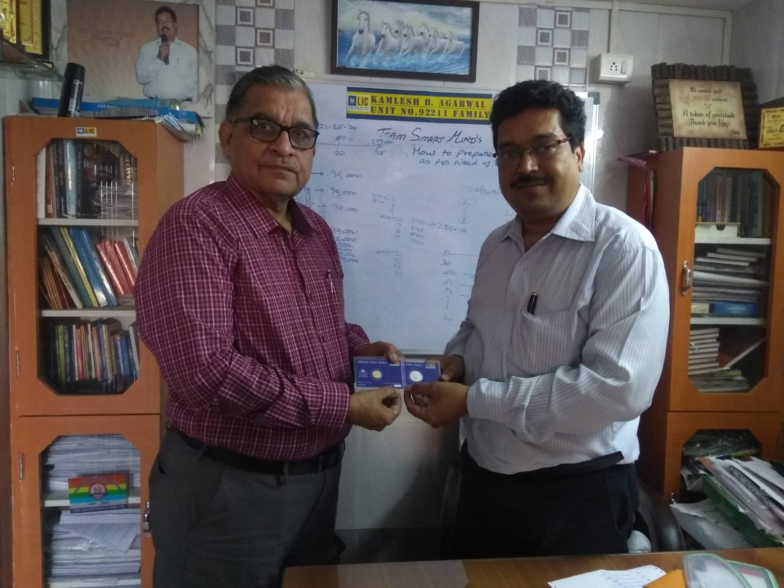 Receiving Gold and Silver coins from Development officer