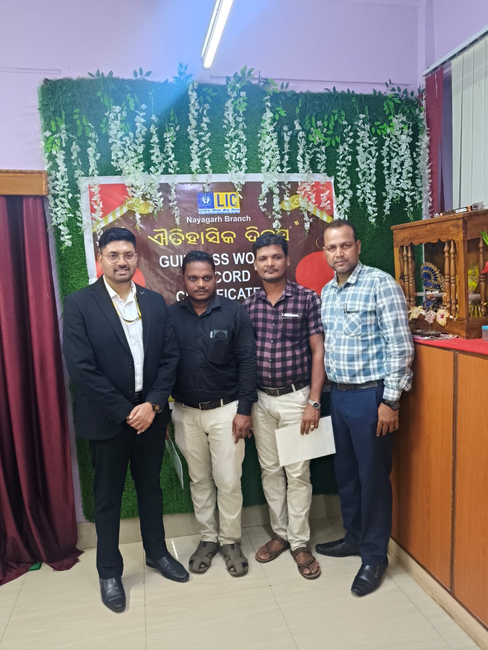 These three are receiving the Guinness World Record certificates