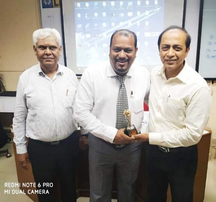 Receiving the World Cup from SDM and MM LIC MDO IV
